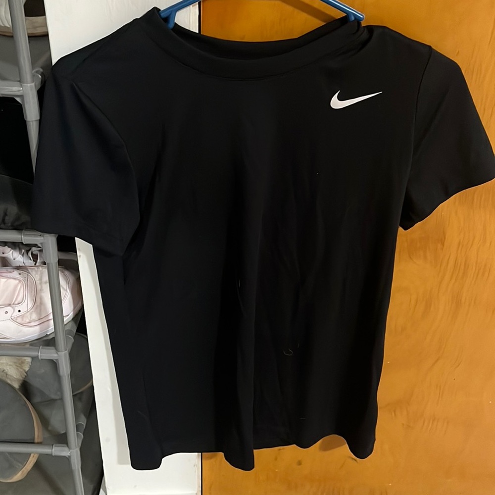 This is a black Nikes sport t-shirt that reduces sweat and helps with sports
